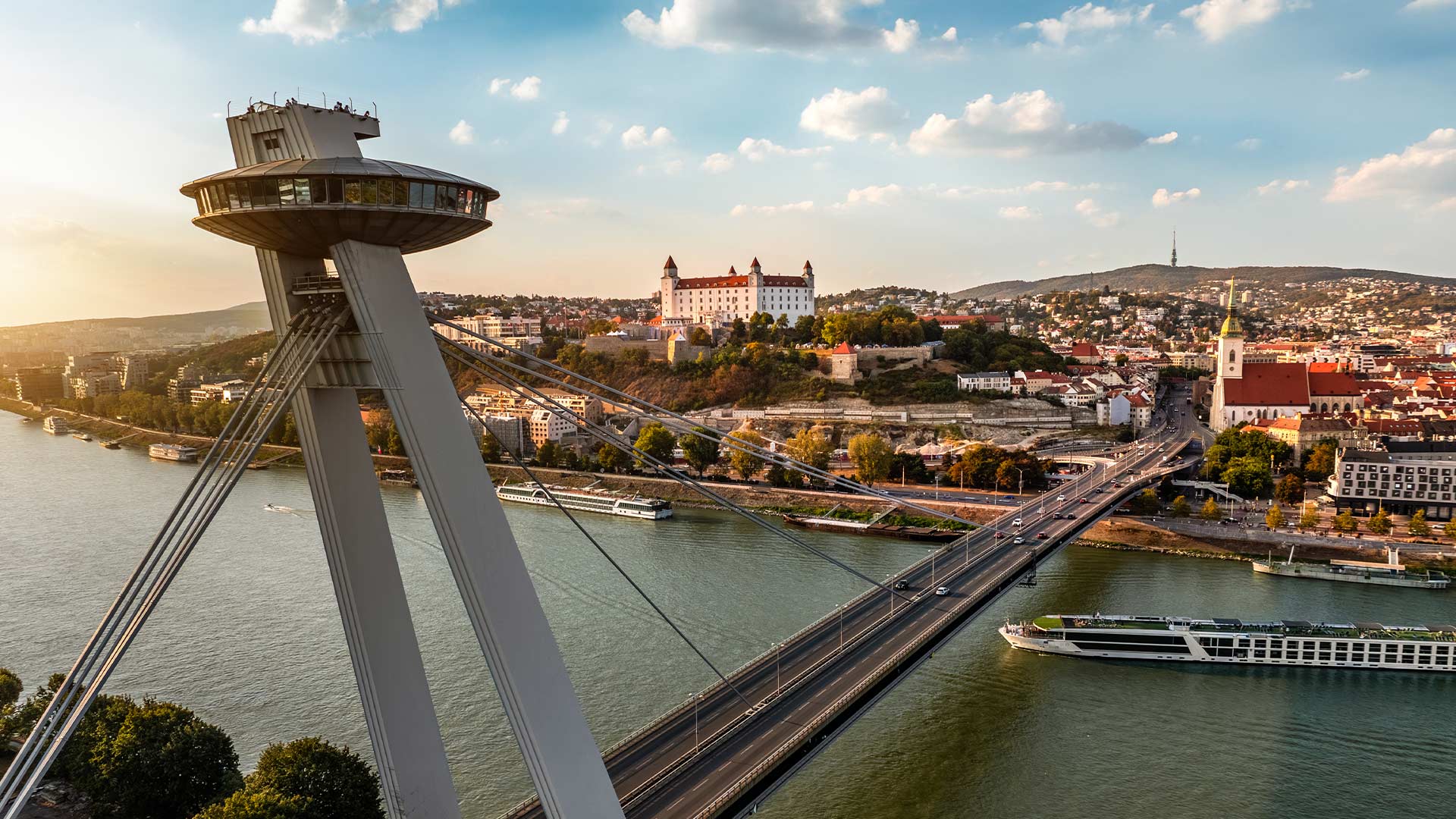 Golden hour over UFO Bridge and castle in Bratislava